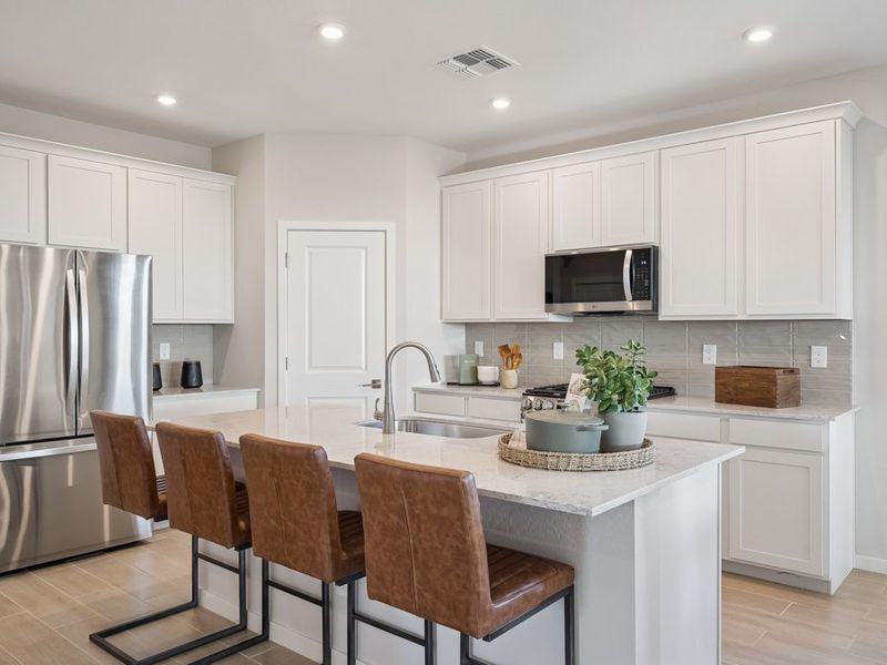 A kitchen with white cabinets. A kitchen with white cabinets.