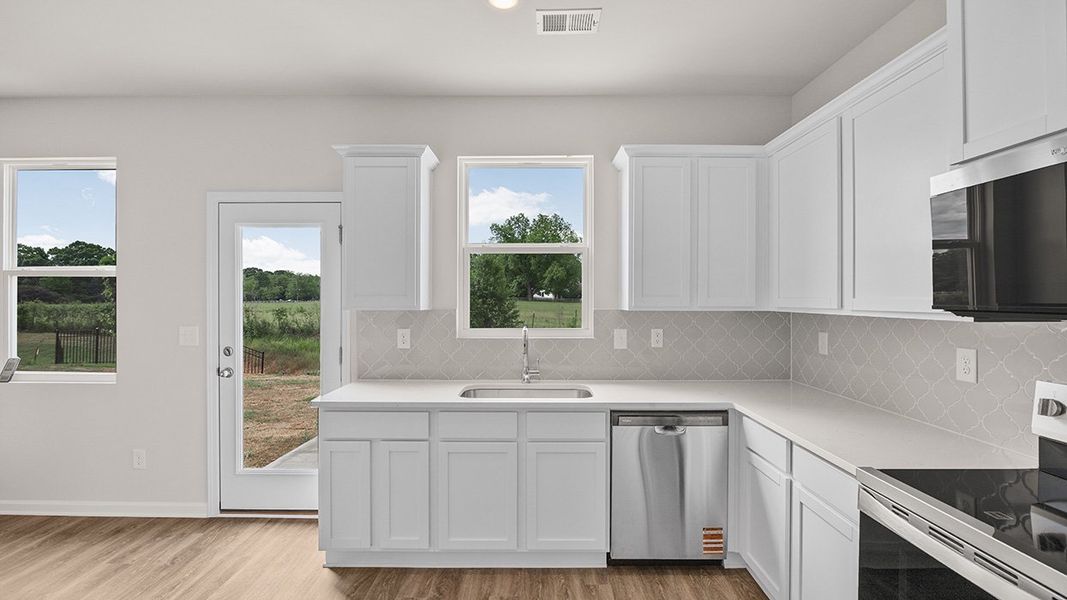 Furnished interior in a model home at Remington Chase in Perry (Image 6).