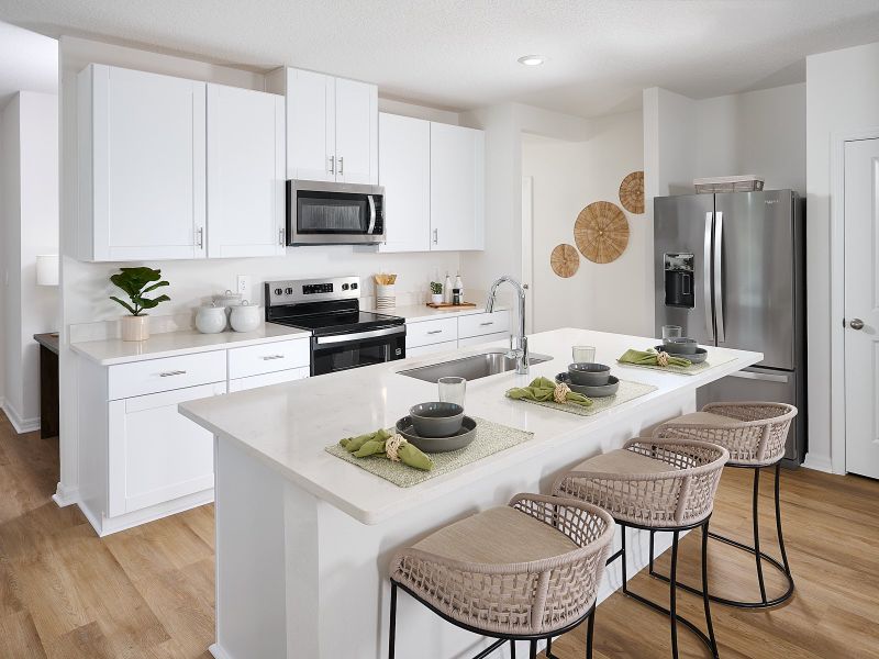 The Acadia Floorplan Kitchen Modeled at Leyland Preserve.