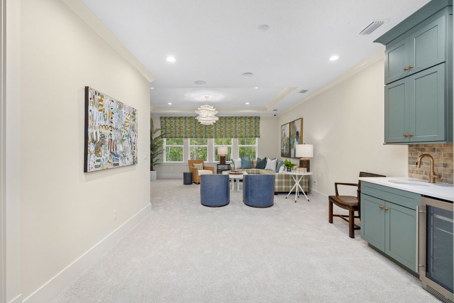 Furnished interior in a model home at Hidden Creek at SilverLeaf 80' Gold Series in St. Augustine (Image 83).