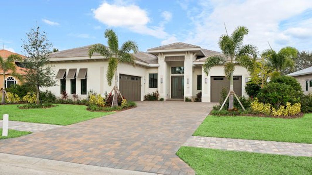 Front exterior of a home in the Tesoro Club community, located in Port St. Lucie, FL (Image 27).