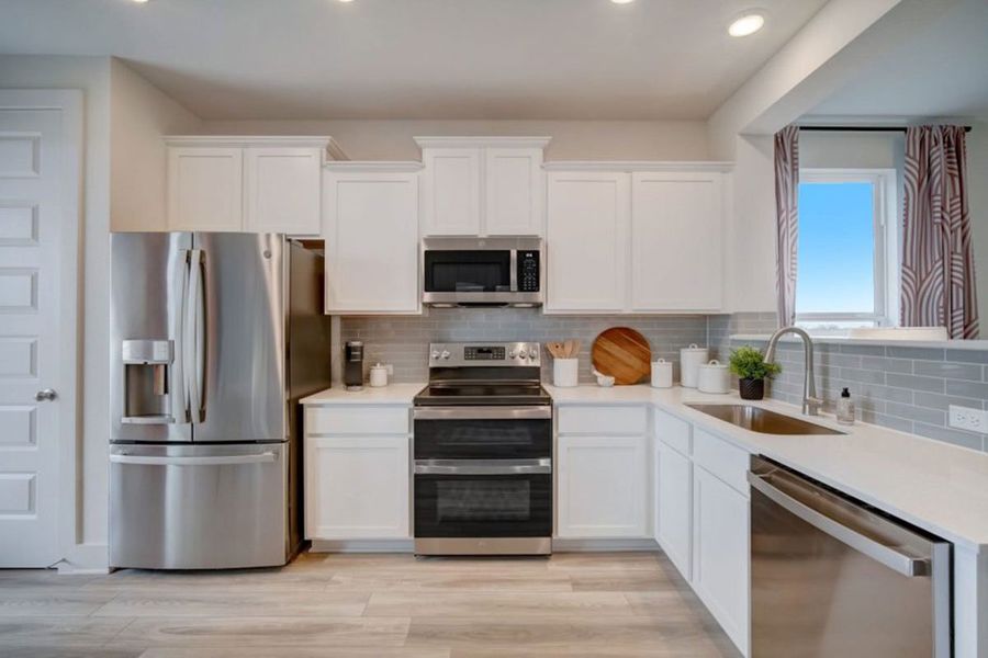 Furnished interior in a model home at Avery Centre in Round Rock (Image 33).