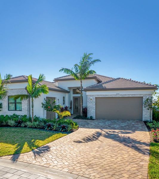 Front exterior of a home in the Valencia Vista at Riverland community, located in Port St. Lucie, FL (Image 4). Front exterior of a home in the Valencia Vista at Riverland community, located in Port St. Lucie, FL (Image 4).