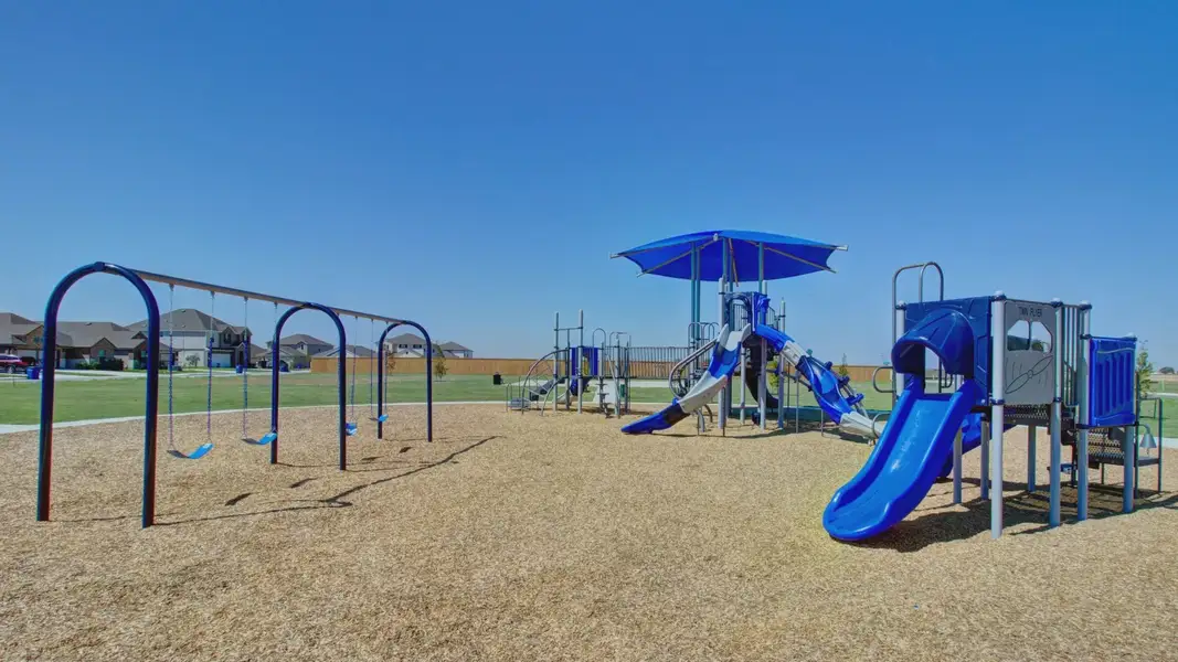 Discover modern outdoor play structures with vibrant slides in Dauer Ranch, surrounded by serene suburban settings. Discover modern outdoor play structures with vibrant slides in Dauer Ranch, surrounded by serene suburban settings.