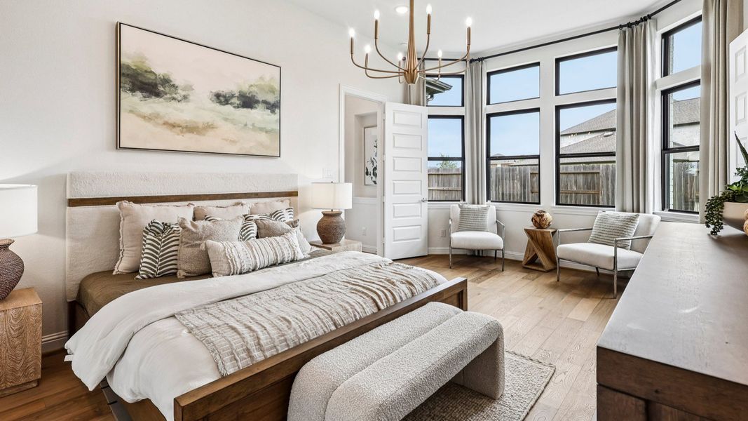 Experience sophistication with high ceilings and abundant natural light in Sunterra community's exquisite bedroom. Experience sophistication with high ceilings and abundant natural light in Sunterra community's exquisite bedroom.