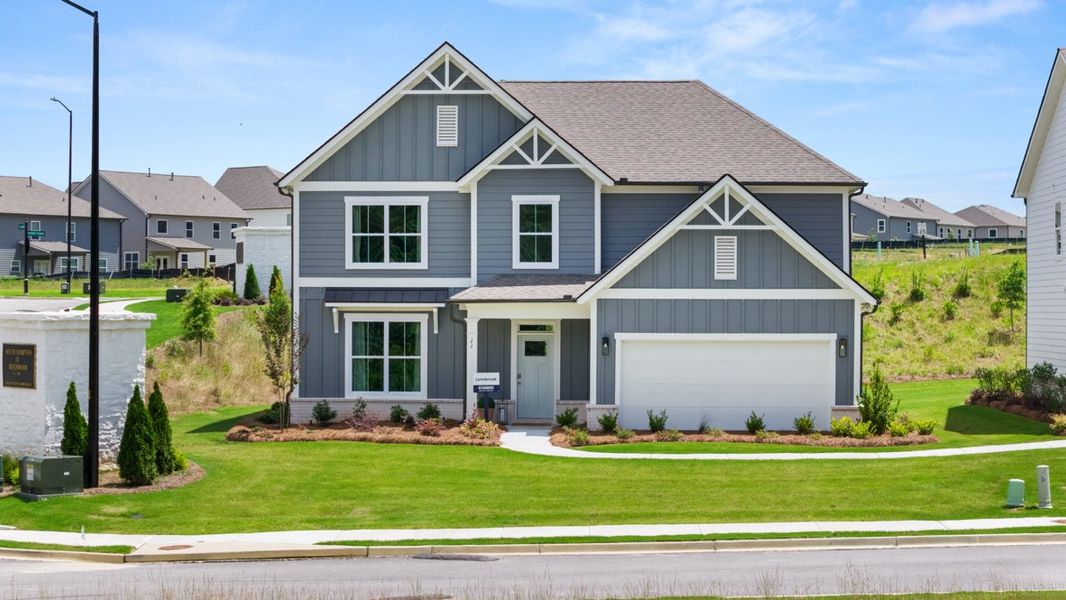 Front exterior of a home in the Hamptons at Riverwood East community, located in Dallas, GA (Image 5).