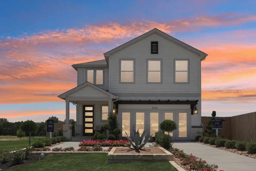 A house with a fountain in front of it. A house with a fountain in front of it.