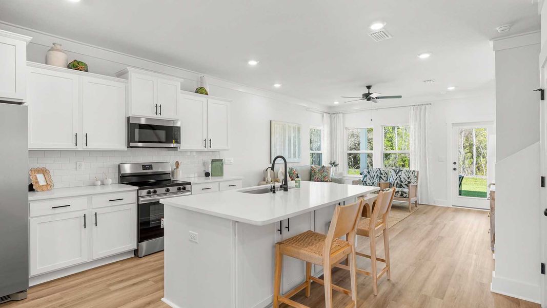 Furnished interior in a model home at Colonial East in Panama City Beach (Image 6).
