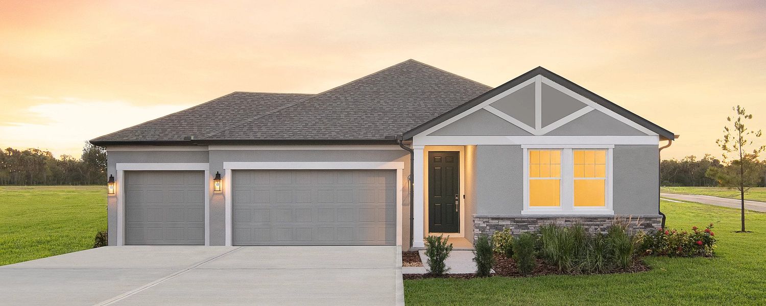 Front exterior of a home in the Oakfield Trails Traditional community, located in Parrish, FL (Image 1).