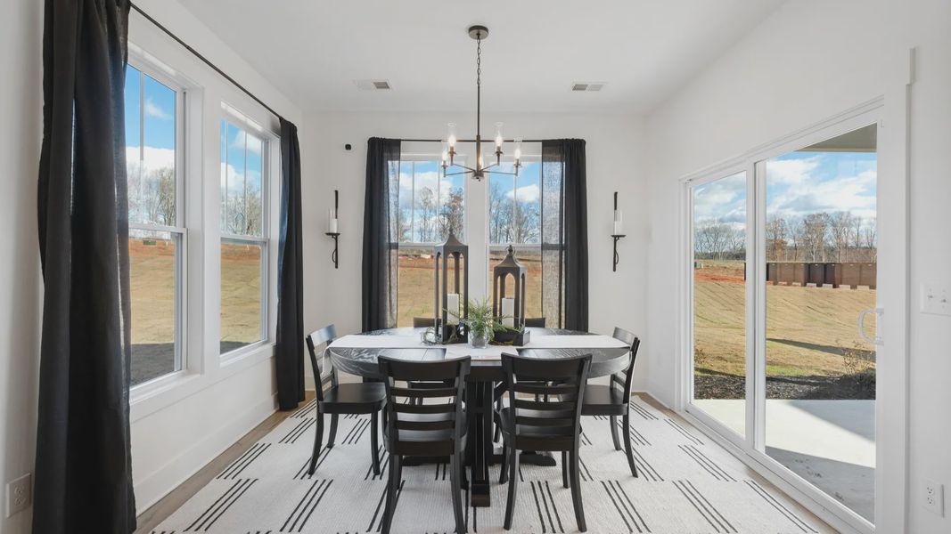 Optional extended breakfast room with multiple large windows and outdoor access in Drayton floorplan at Fox Hollow