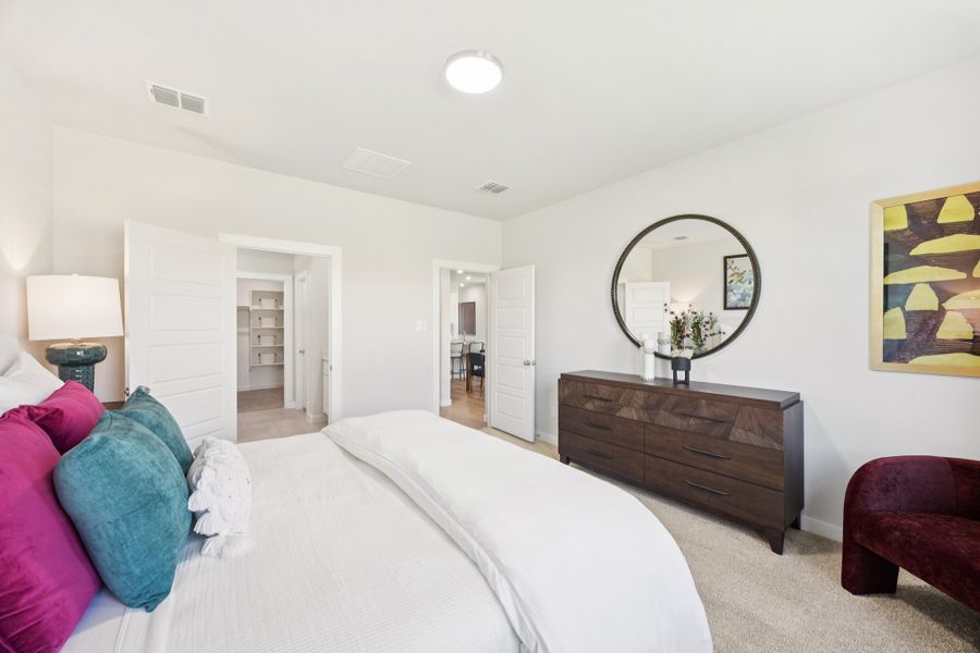 Primary Suite in a Belmont Magnolia Model Home in Aubrey TX by Trophy Signature Homes Primary Suite in a Belmont Magnolia Model Home in Aubrey TX by Trophy Signature Homes