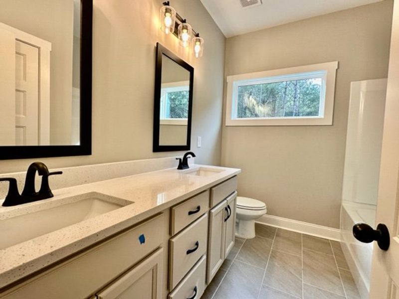 Furnished interior in a model home at Polk Place in Moreland (Image 4).