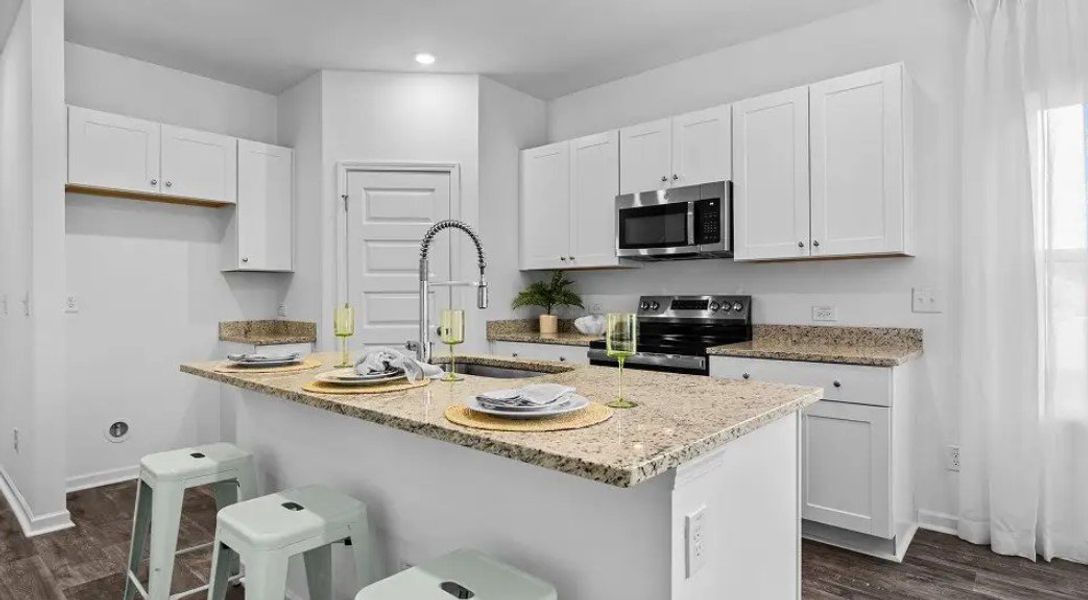 Furnished interior in a model home at Champions Park in Longs (Image 3).