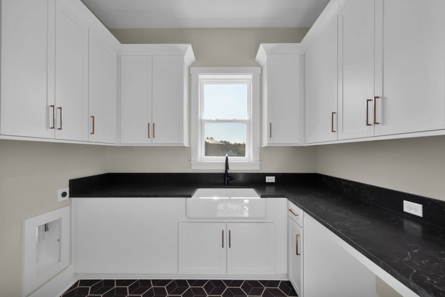 Furnished interior in a model home at Hidden Creek at SilverLeaf in St. Augustine (Image 1).