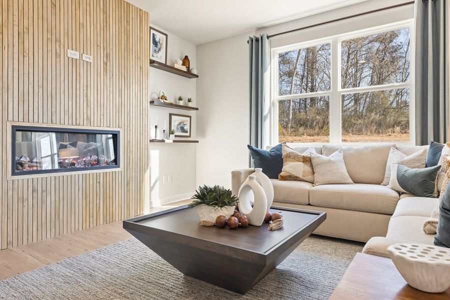 A living room with a fireplace. A living room with a fireplace.