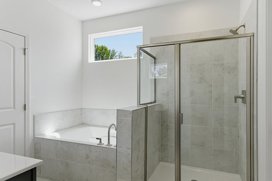 A bathroom with a glass shower.