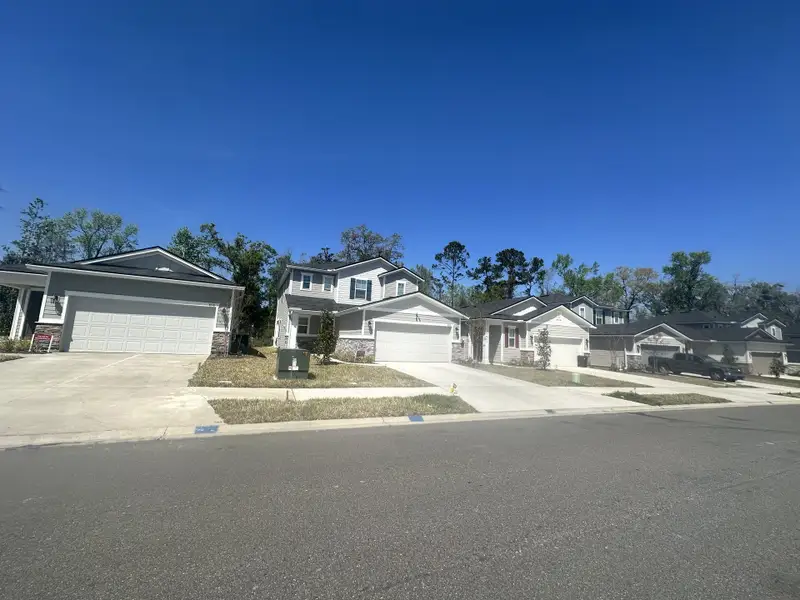 Modern homes with spacious driveways in Seasons at Marietta Cove by Richmond American Homes (Jacksonville, FL).
