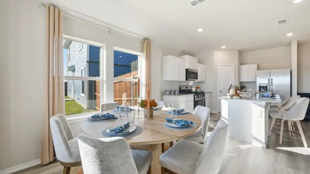 Furnished interior in a model home at Webster Meadows in Ponder (Image 5).