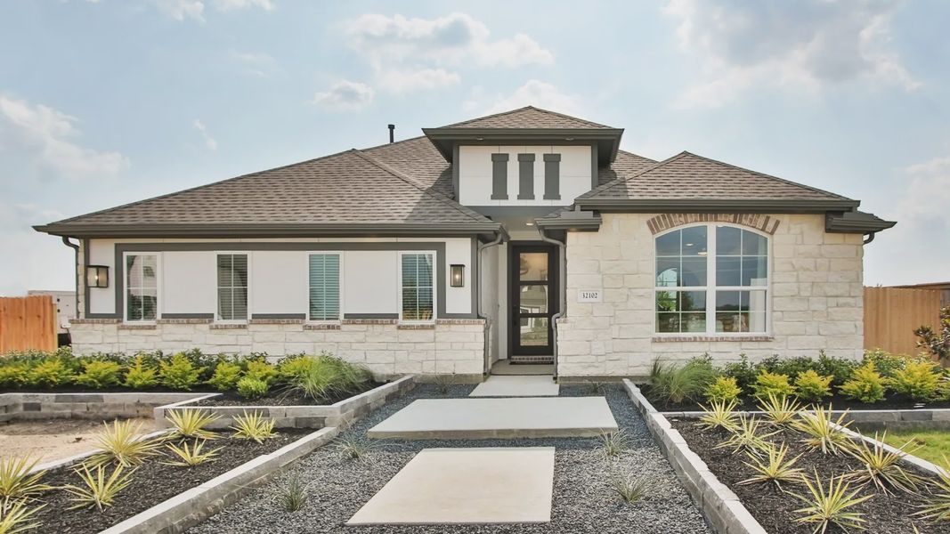 Discover refined elegance with a stone facade and arched windows, nestled in Oakwood Estates. Discover refined elegance with a stone facade and arched windows, nestled in Oakwood Estates.