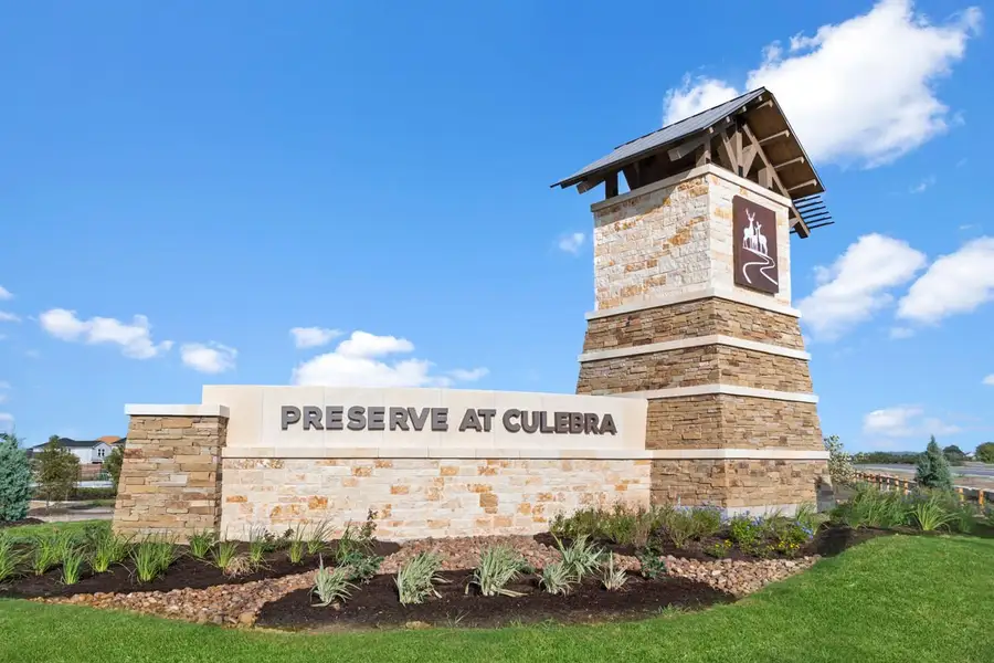 Entrance to the Preserve at Culebra - Sterling Collection community in San Antonio, TX, featuring signage and landscaping (Image 2).