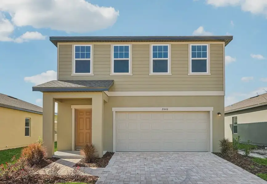 Front exterior of a home in the Landings at Mount Olive community, located in Polk City, FL (Image 4).