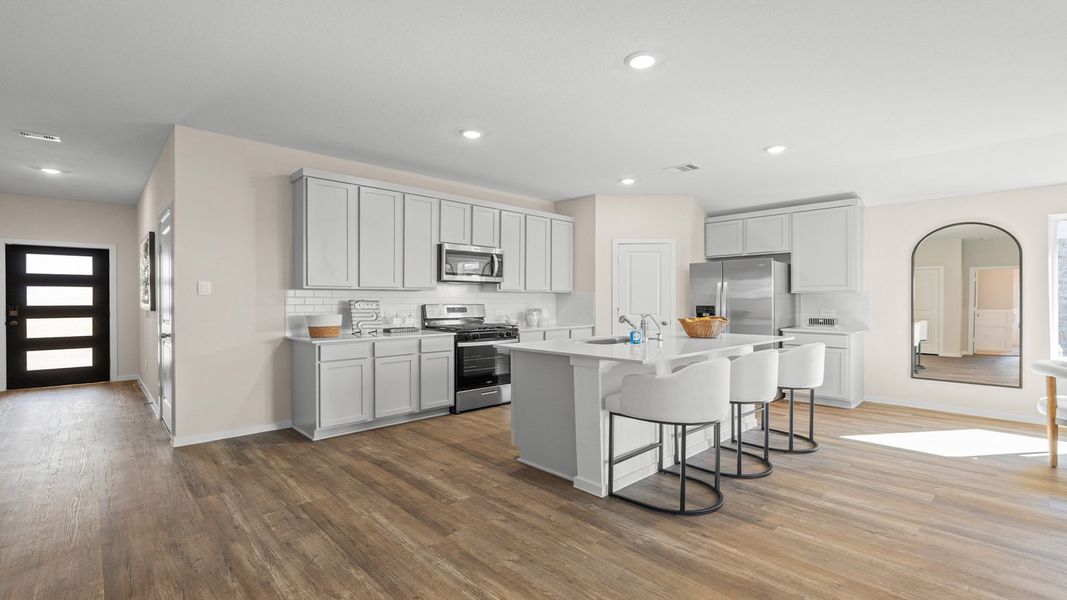 Furnished interior in a model home at Sunterra Lakes in Brookshire (Image 8).