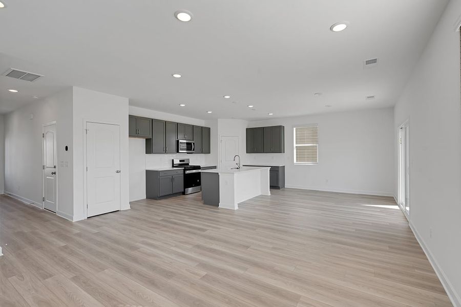 A large empty kitchen. A large empty kitchen.