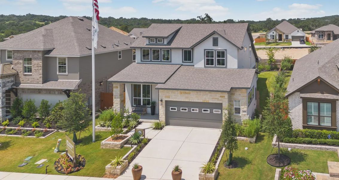Front exterior of a home in the Meyer Ranch community, located in New Braunfels, TX (Image 17).