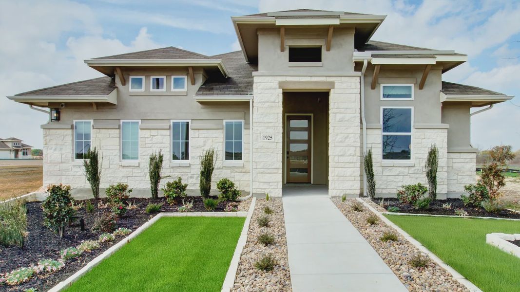 Elegant stone facade and pristine landscaping detail this Veranda community gem.