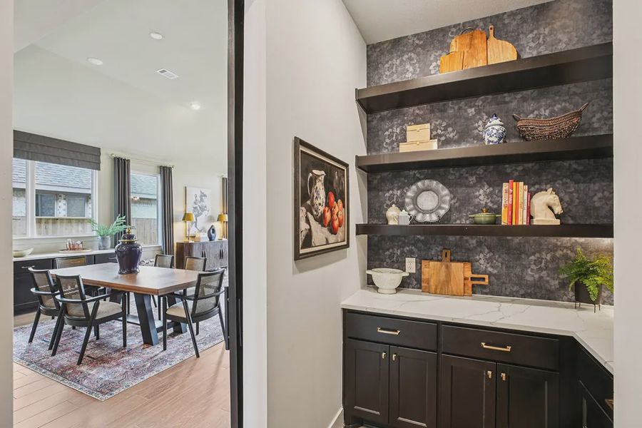 Furnished interior in a model home at Meridiana 50's in Manvel (Image 34).
