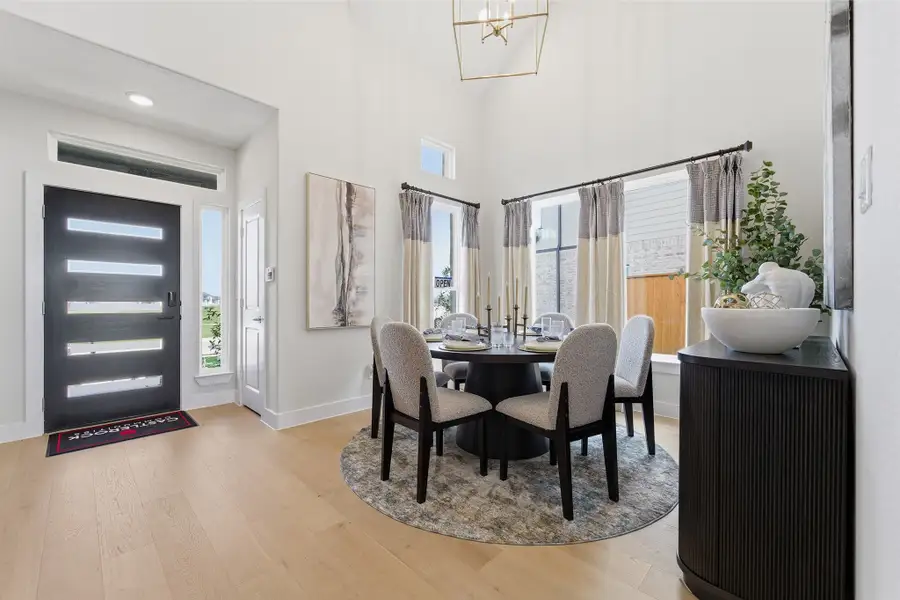 Furnished interior in a model home at Wildrye in Waller (Image 6).