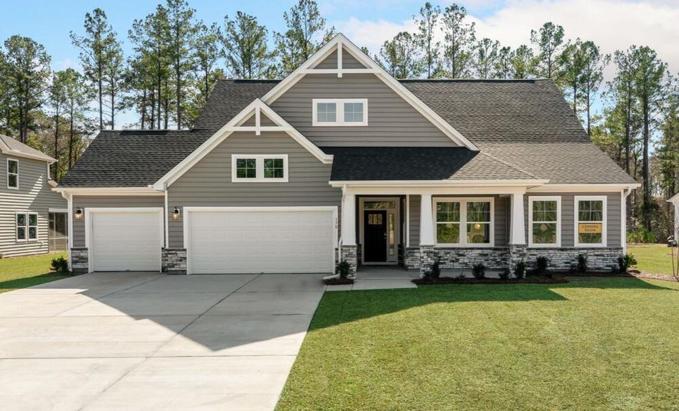 Front exterior of a home in the The Enclave at French Quarter Creek community, located in Huger, SC (Image 8).