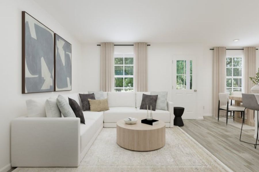 A living room with a white couch. A living room with a white couch.