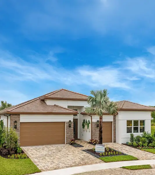 Front exterior of a home in the Valencia Ridge (55+) community, located in Wesley Chapel, FL (Image 4). Front exterior of a home in the Valencia Ridge (55+) community, located in Wesley Chapel, FL (Image 4).