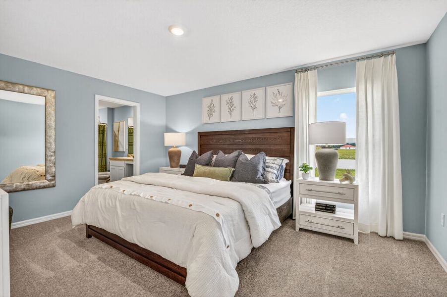 Furnished interior in a model home at Mallard Landing in Okeechobee (Image 13).