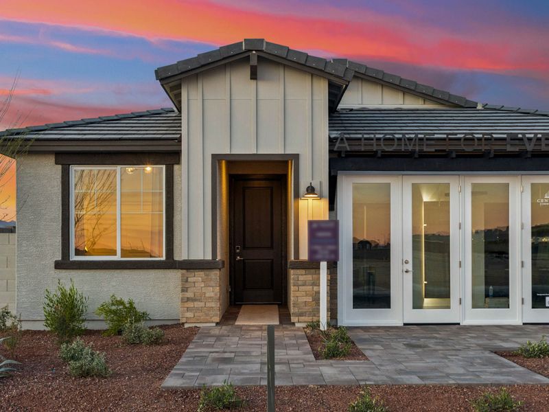 A house with a brick driveway.