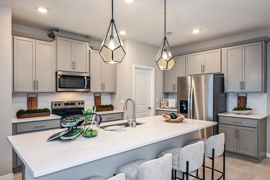 Furnished interior in a model home at Towns at Riverwalk: Lake Monroe TH in Sanford (Image 11).