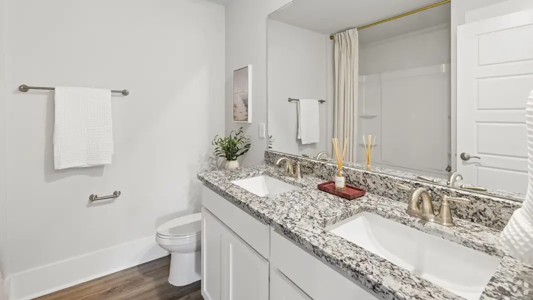Furnished interior in a model home at The Willows at Blake Farm EXP in Wilmington (Image 30). Furnished interior in a model home at The Willows at Blake Farm EXP in Wilmington (Image 30).