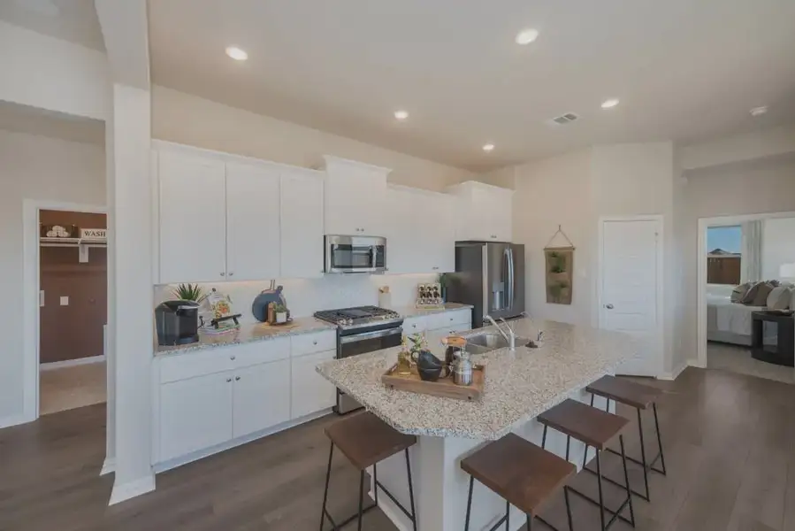 Furnished interior in a model home at Bel Air Village in Sherman (Image 4).