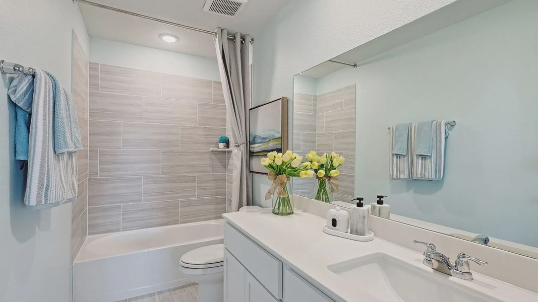 Luxurious bath with sleek tiles and minimalist fixtures, elevating charm in Patriot Estates. Luxurious bath with sleek tiles and minimalist fixtures, elevating charm in Patriot Estates.
