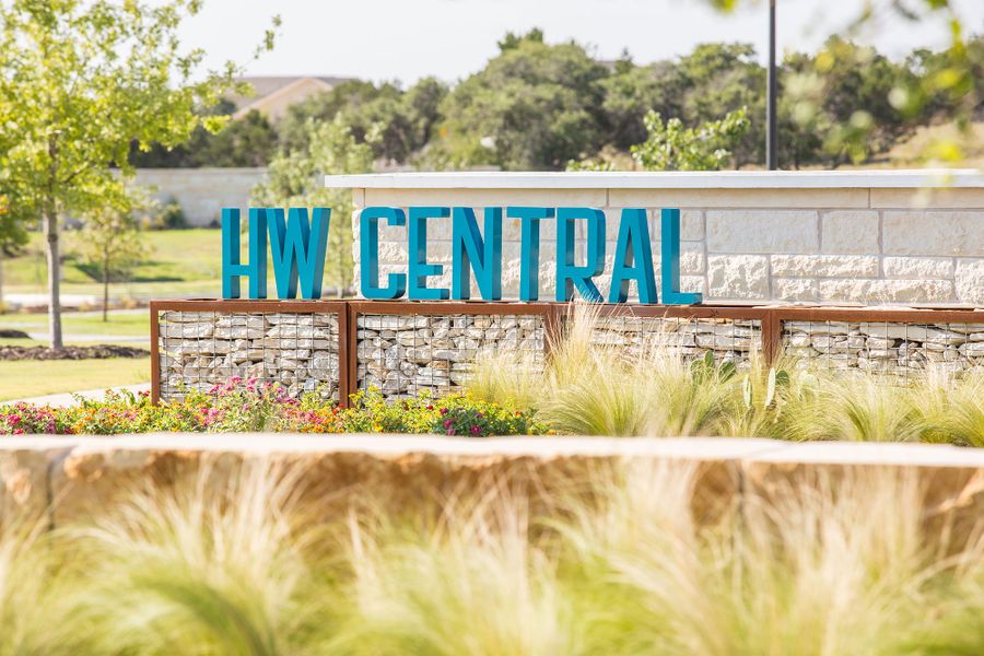 Entrance to the Headwaters 60' - Executive Series community in Dripping Springs, TX, featuring signage and landscaping (Image 6).