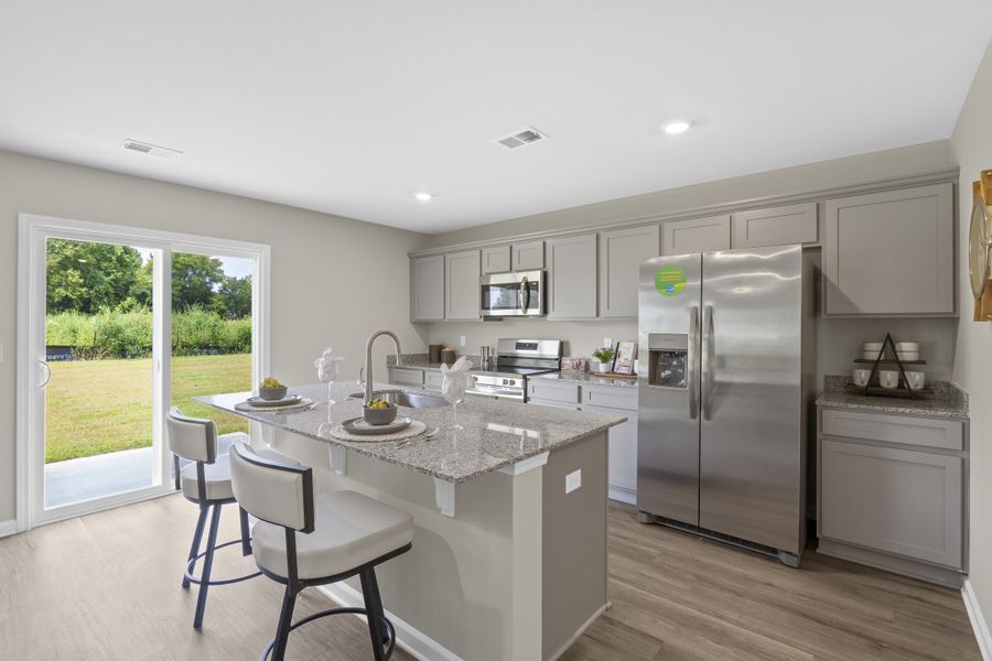 Furnished interior in a model home at Harmon Terrace in Hopkins (Image 17).