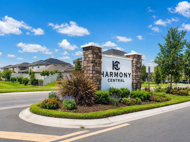 Entrance to the Harmony Central community in St. Cloud, FL, featuring signage and landscaping (Image 2). Entrance to the Harmony Central community in St. Cloud, FL, featuring signage and landscaping (Image 2).