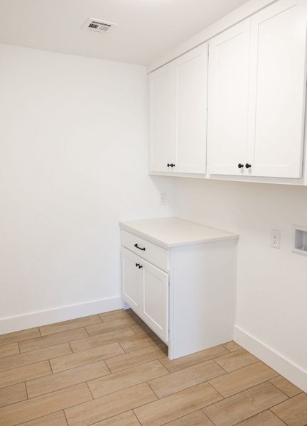 Furnished interior in a model home at Callan Village in San Antonio (Image 22).