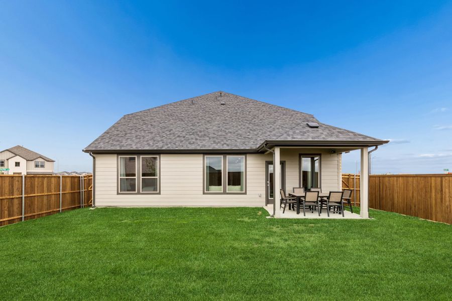 Covered Patio in a Madero New Winters Model in Haslet TX by Trophy Signature Homes
