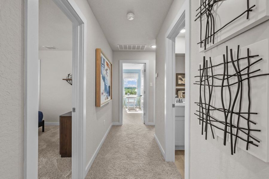 A hallway with white walls.