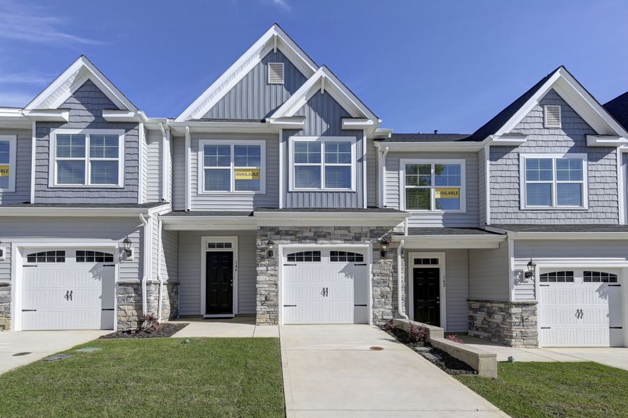 Front exterior of a home in the Kensington Place Townhomes community, located in Lexington, SC (Image 1). Front exterior of a home in the Kensington Place Townhomes community, located in Lexington, SC (Image 1).