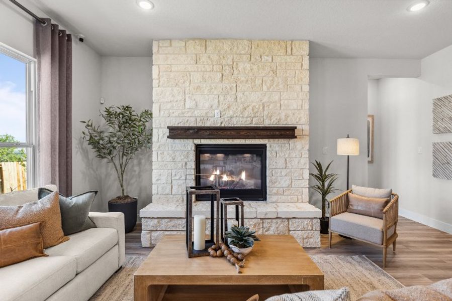 A living room with a fireplace.