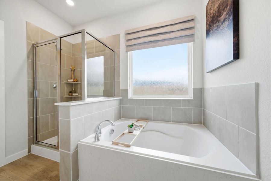 A bathroom with a tub and sink.