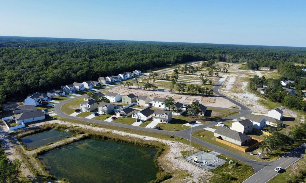 A group of houses next to a river.